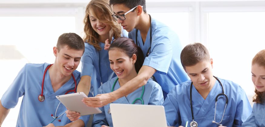 Group of medical students having lecture indoors